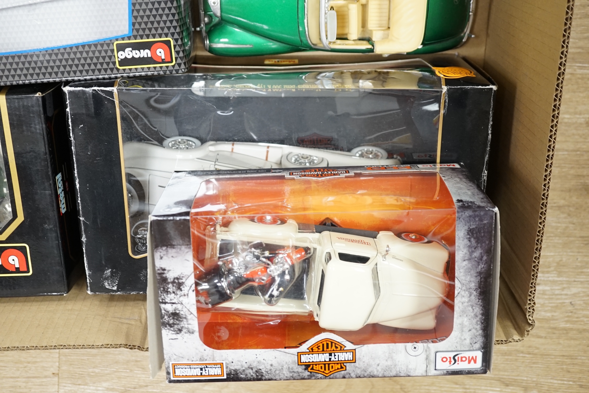 A quantity of diecast vehicles, including Burago, Harley Davidson, Maisto, etc. Condition - varies